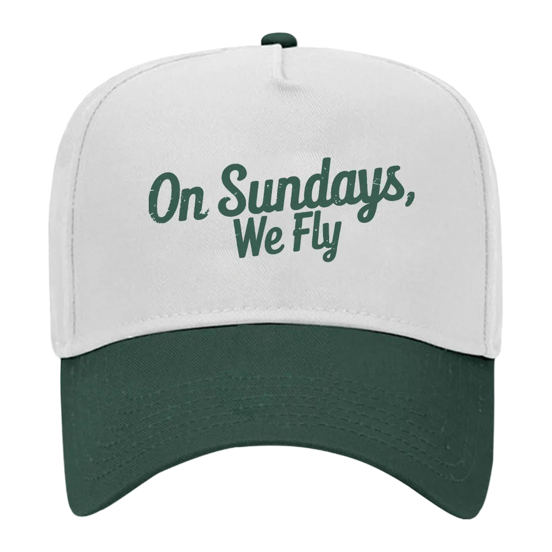 A white and green snapback hat with the text &