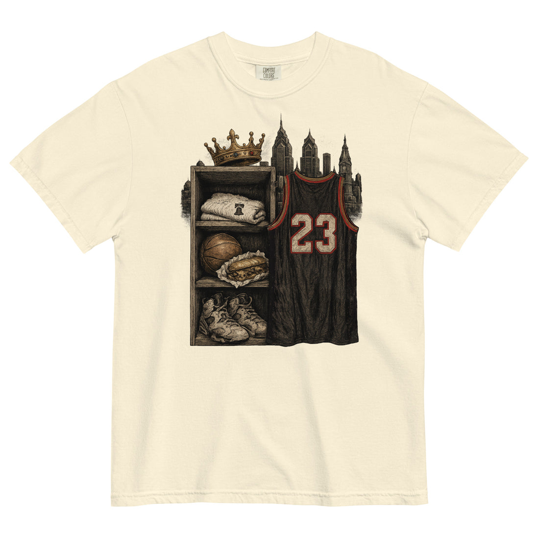 An off-white short-sleeve crewneck t-shirt featuring a graphic print of a basketball jersey with the number 23 hanging next to a shelf with a crown, sneakers, and a towel, set against a plain white background.