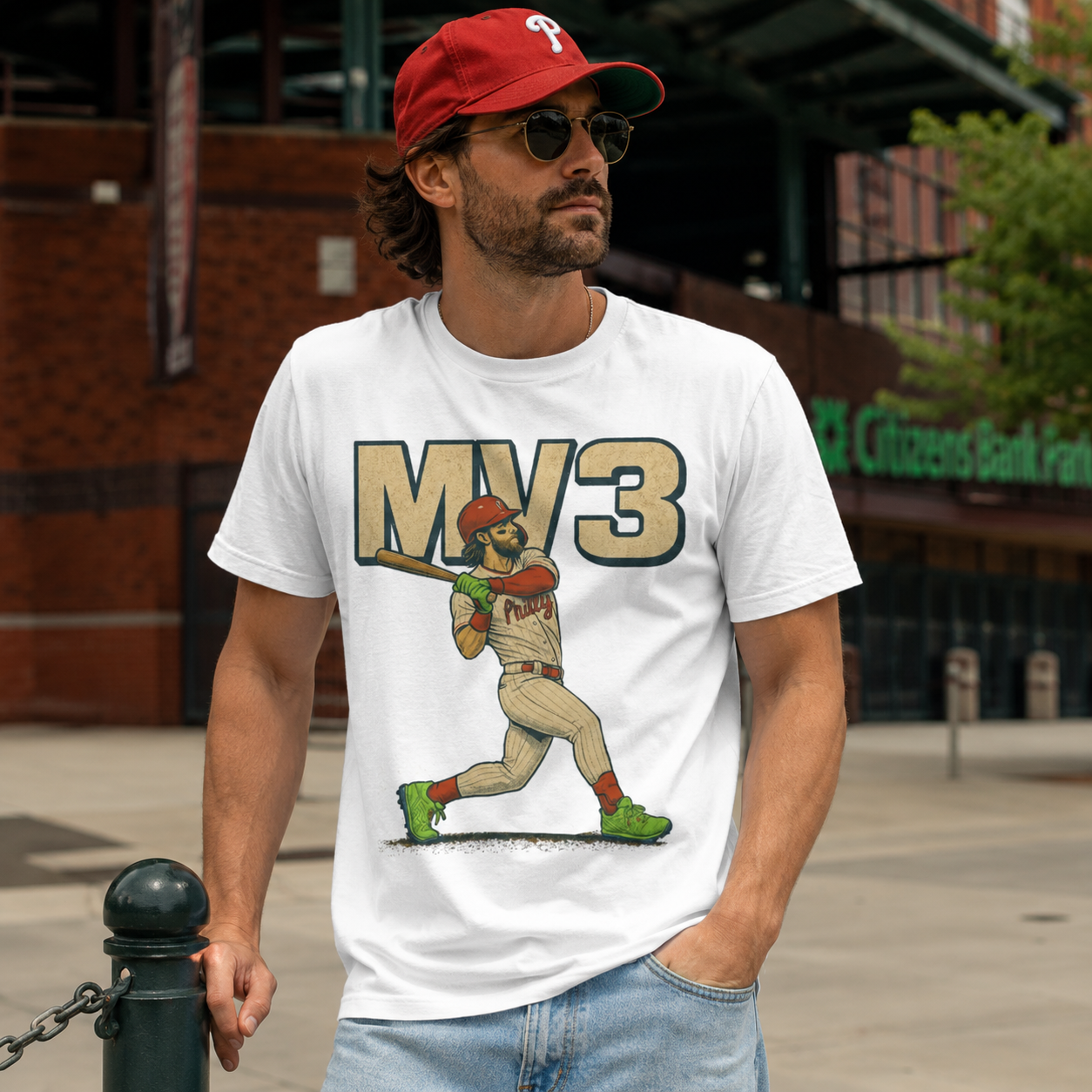 Man wearing a white t-shirt with a baseball player graphic and &