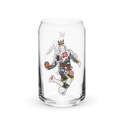 A clear glass can-shaped drinking tumbler featuring a stylized graphic of a basketball player in a white Philadelphia 76ers jersey with the number 25, holding a basketball and wearing a crown.